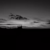Večerní panorama Prahy s barevným západem slunce v černobílé verzi, autor Martin Lukač, pražský fotograf, www.martinlukac.eu